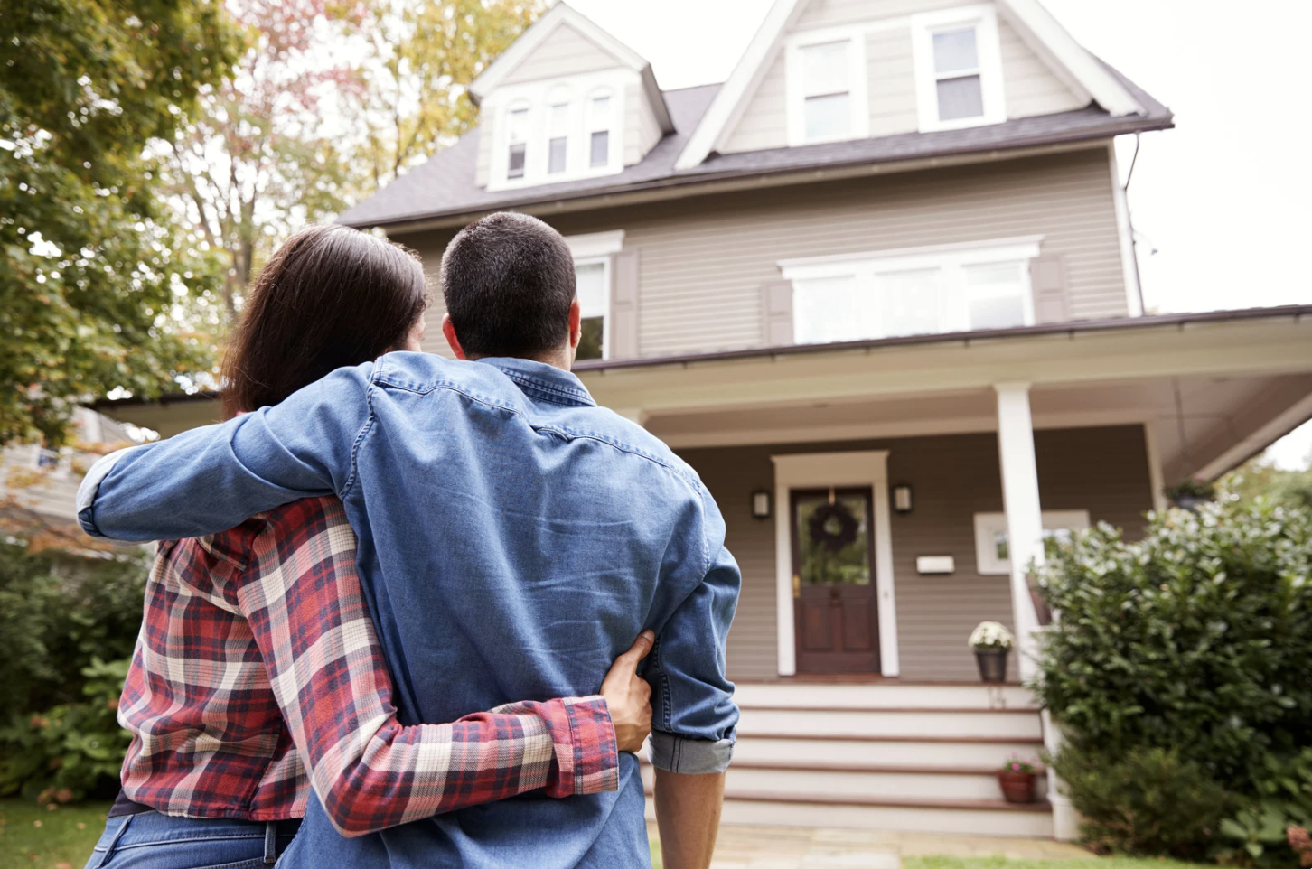 A couple looking at their newly purchased home.