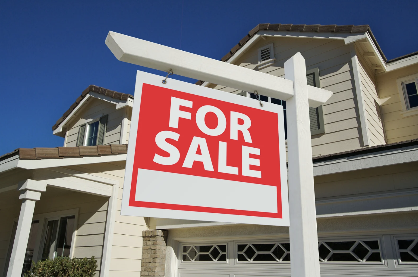 For Sale Sign in front of a house.