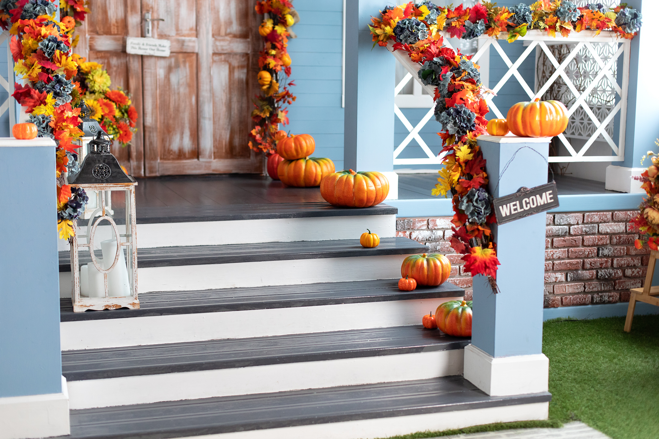 A front door porch featuring festive Halloween decorations.