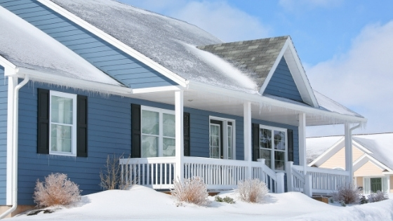 A house in the winter covered with snow.