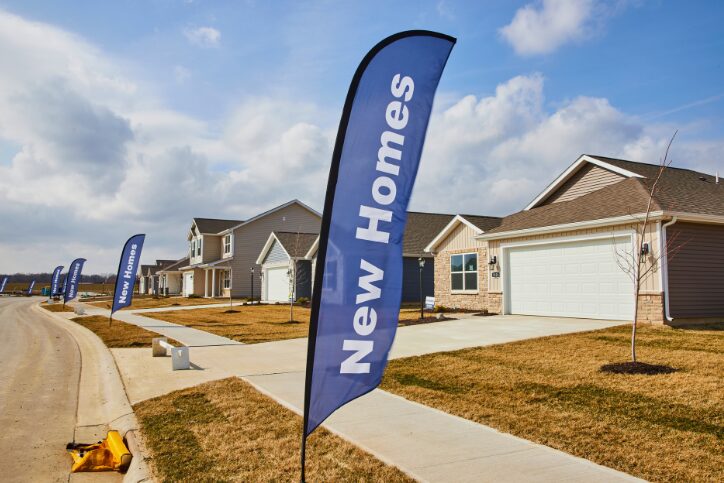 Newly developed neighborhood with a “New Homes” flag